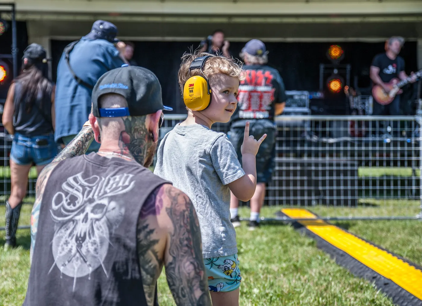 A father and son watching a band at Rockstalgia 2026