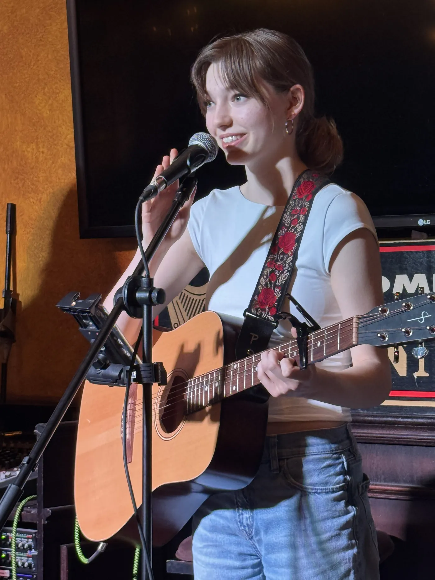 A singer-songwriter performing at She Rocks