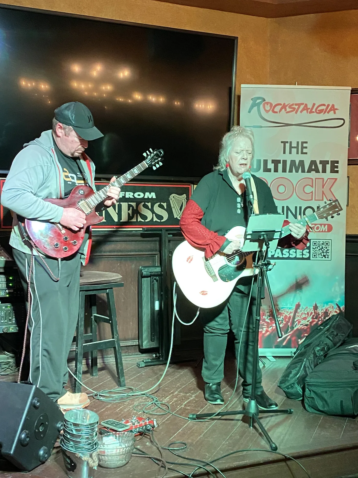 A guitar duo performing at She Rocks